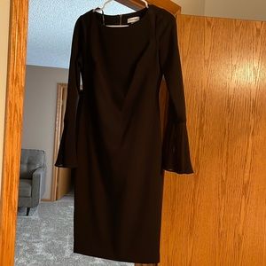Black, just below the knee Calvin Klein dress with button details & bell sleeves